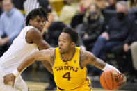 Arizona State forward Kimani Lawrence, right, drives past Colorado forward Jabari Walker during the first half of an NCAA college basketball game Thursday, Feb. 24, 2022, in Boulder, Colo. (AP Photo/David Zalubowski)