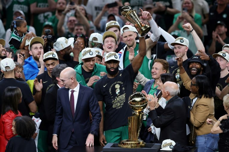 <a class="link " href="https://sports.yahoo.com/nba/players/5602/" data-i13n="sec:content-canvas;subsec:anchor_text;elm:context_link" data-ylk="slk:Jaylen Brown;sec:content-canvas;subsec:anchor_text;elm:context_link;itc:0">Jaylen Brown</a> of the <a class="link " href="https://sports.yahoo.com/nba/teams/boston/" data-i13n="sec:content-canvas;subsec:anchor_text;elm:context_link" data-ylk="slk:Boston Celtics;sec:content-canvas;subsec:anchor_text;elm:context_link;itc:0">Boston Celtics</a> holds up the Bill Russell NBA Finals Most Valuable Player award after the Celtics' title-clinching victory over the <a class="link " href="https://sports.yahoo.com/nba/teams/dallas/" data-i13n="sec:content-canvas;subsec:anchor_text;elm:context_link" data-ylk="slk:Dallas Mavericks;sec:content-canvas;subsec:anchor_text;elm:context_link;itc:0">Dallas Mavericks</a> (Adam Glanzman)