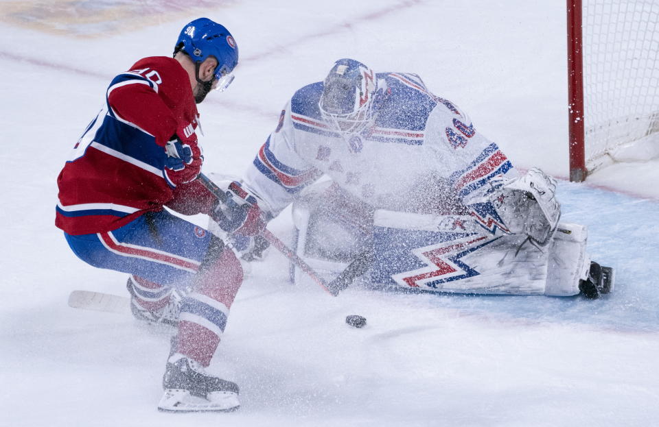 Montreal Canadiens' Tomas Tatar goes up to score against New York Rangers goaltender Alexandar Georgiev during the second period of an NHL hockey game Thursday, Feb. 27, 2020, in Montreal. (Paul Chiasson/The Canadian Press via AP)