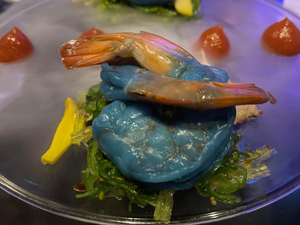 Blue-colored shrimp on a glass plate