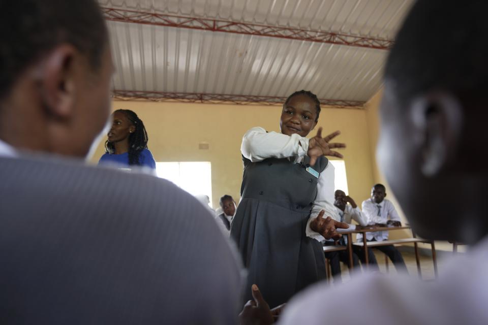 Bridget Chanda, center, interprets climate change terms to students, who are deaf, during a lesson at Chileshe Chepela Special School in Kasama, Zambia, Wednesday, March 6, 2024. Chanda is intent on helping educate Zambia's deaf community about climate change. (AP Photo/Tsvangirayi Mukwazhi)