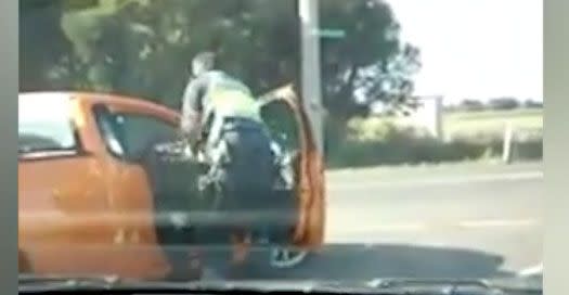 The officer physically drags the driver out of the ute. Source: 7 News