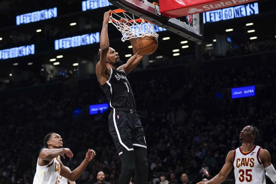 FILE -B rooklyn Nets' Kevin Durant dunks the ball during the second half of the opening basketball game of the NBA play-in tournament against the Cleveland Cavaliers, Tuesday, April 12, 2022, in New York. Kevin Durant has requested a trade from the Brooklyn Nets, according to a person with direct knowledge of the seismic decision that undoubtedly will have teams scrambling to put together enormous offers for the perennial All-Star. (AP Photo/Seth Wenig, File)