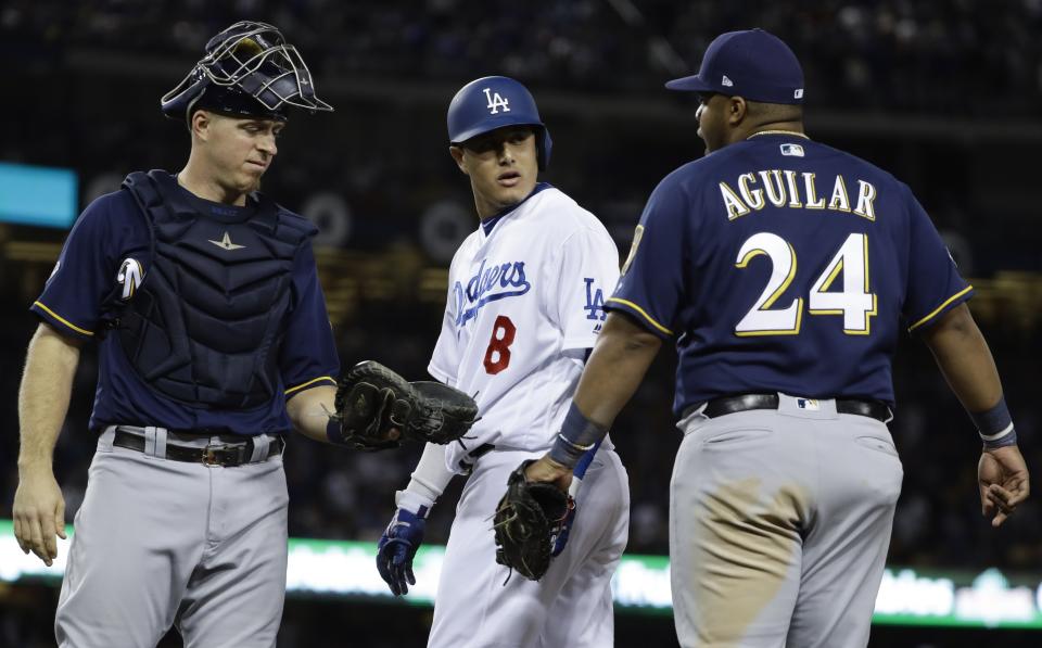 Manny Machado was fined for making contact with Jesús Aguilar. (AP Photo)