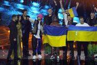 Kalush Orchestra from Ukraine celebrates after winning the Grand Final of the Eurovision Song Contest at Palaolimpico arena, in Turin, Italy, Saturday, May 14, 2022. (AP Photo/Luca Bruno)