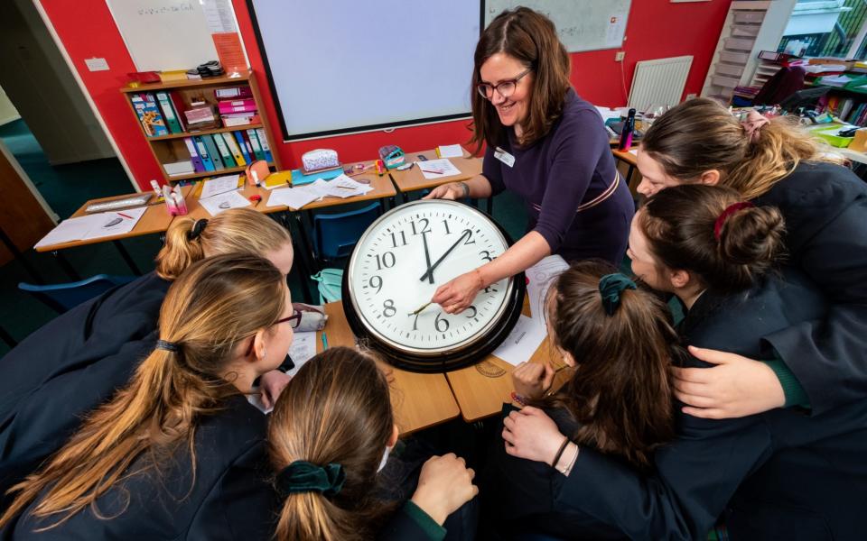 Head of Maths, Mrs Stephanie Speed, during her class aimed at teaching pupils at Kilgraston School for Girls, Bridge of Earn, how to tell the time using an analogue clock,  - Â©Stuart Nicol Photography