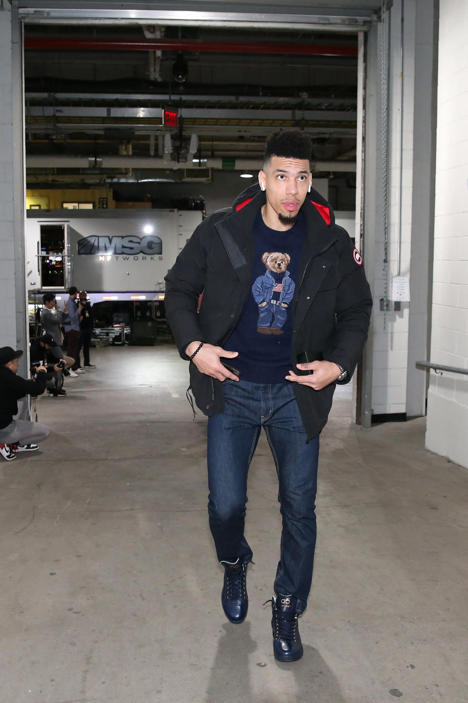 <p>Danny Green wears the Ralph Lauren Polo Bear sweater into the Barclays Center on April 3. </p>