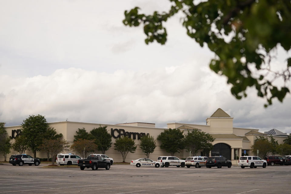 Authorities stage in a parking lot at Columbiana Centre mall in Columbia, S.C., following a shooting, Saturday, April 16, 2022. (AP Photo/Sean Rayford)