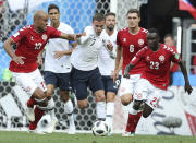 <p>Antoine Griezmann keeps hold of the ball under pressure from Denmark’s Mathias Jorgensen and Pione Sisto </p>
