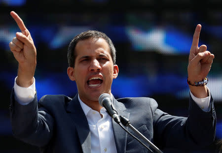 Venezuelan opposition leader and self-proclaimed interim president Juan Guaido gestures during a rally against Venezuelan President Nicolas Maduro's government in Caracas, Venezuela February 2, 2019. REUTERS/Carlos Garcia Rawlins