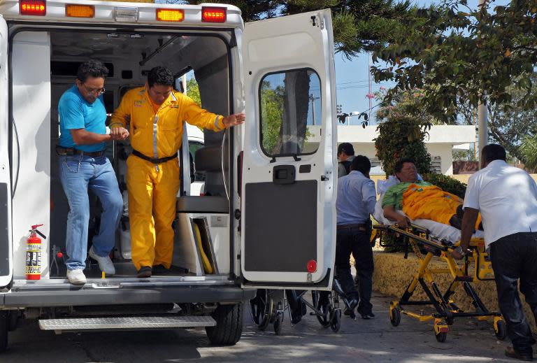 Wounded workers arrive at the general hospital after being evacuated from the Abkatun A-Permanente platform on the Gulf of Mexico's Campeche Sound on April 1, 2015