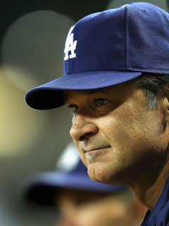 Don Mattingly watches from the dugout during a July 15 game vs. Arizona. A 6-4 victory that night gave the Dodgers a five-game winning streak