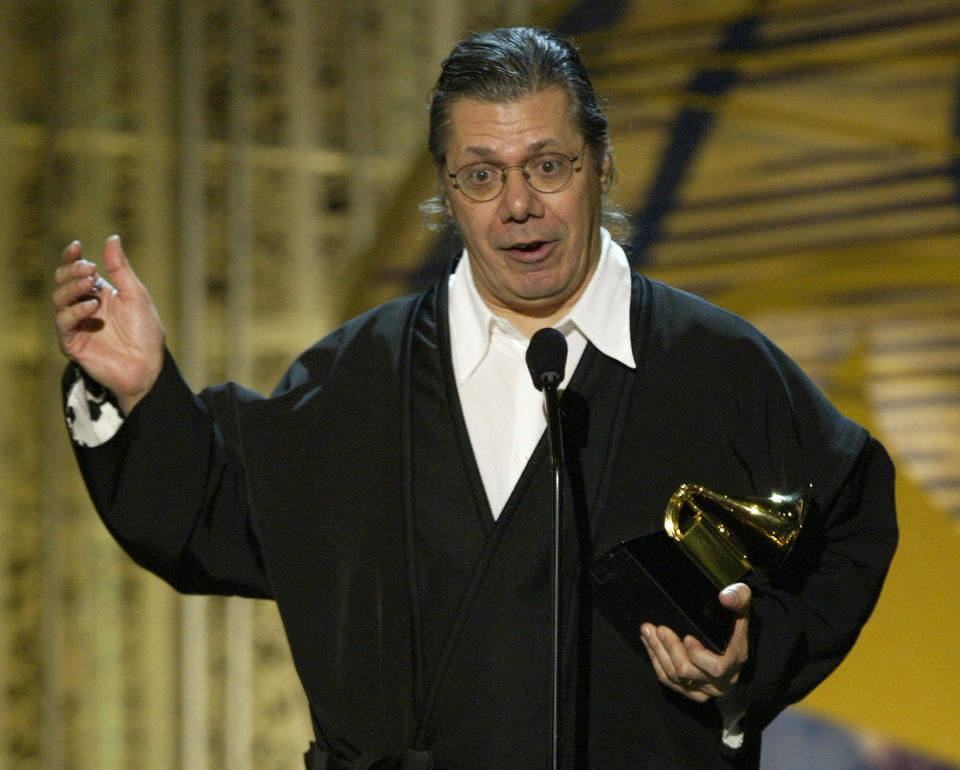 FILE - Chick Corea accepts his award for best jazz instrumental solo for "Matrix" during the 46th Annual Grammy Awards on Feb. 8, 2004, in Los Angeles. Corea, a towering jazz pianist with a staggering 23 Grammy awards who pushed the boundaries of the genre and worked alongside Miles Davis and Herbie Hancock, has died. He was 79. Corea died Tuesday, Feb. 9, 2021, of a rare for of cancer, his team posted on his web site. His death was confirmed by Corea's web and marketing manager, Dan Muse. (AP Photo/Kevork Djansezian, File)