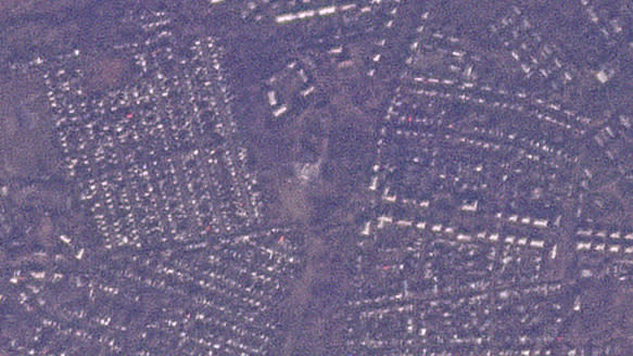 This satellite photo from Planet Labs PBC shows the remains of a vocational school in the Russian-occupied town of Makiivka, Ukraine, Jan. 2, 2023. Satellite photos analyzed by The Associated Press on Tuesday show the aftermath of a major strike by Ukrainian forces that Moscow says killed 63 Russian troops. (Planet Labs PBC via AP)