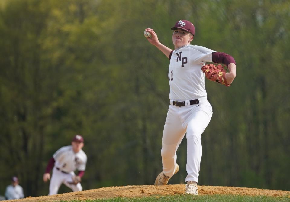 New Paltz pitcher Jack Maiale (11) delivers a pitch during their 7-1 win over Red Hook in baseball action at New Paltz High School on Wednesday, April 26, 2023. 
