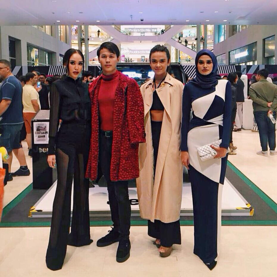 Naim (2nd left) has no qualms about wearing his thrift store finds to high-fashion events. — Picture from Twitter/naimxazhar