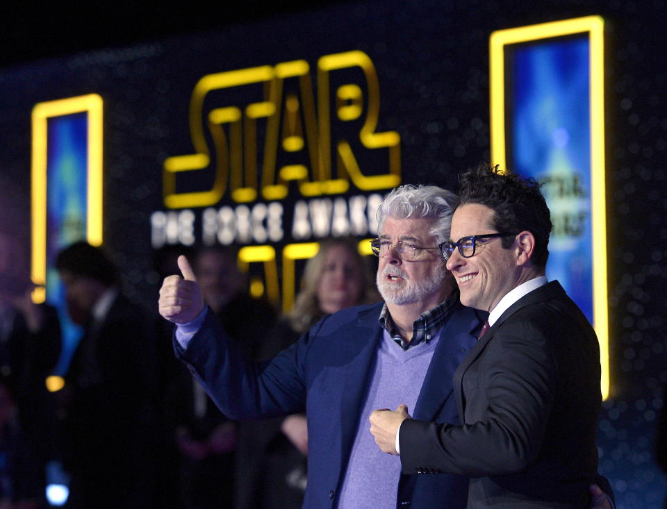 Star Wars creator George Lucas (L) and director JJ Abrahms pose at the premiere of "Star Wars: The Force Awakens" in Hollywood, California December 14, 2015. REUTERS/Kevork Djansezian      TPX IMAGES OF THE DAY     