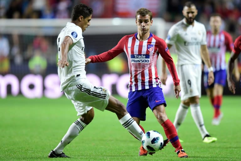 Atletico Madrid's Antoine Griezmann and Real Madrid's Raphael Varane clash during the UEFA Super Cup in Tallinn, which Atletico won in extra time