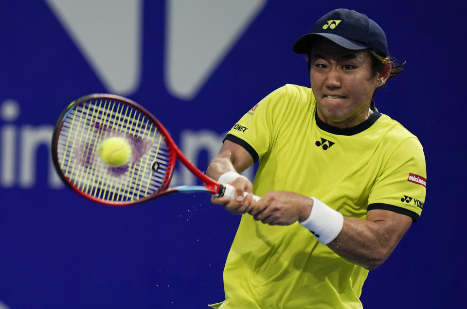 Yoshihito Nishioka of Japan returns a ball during a match against to Matteo Berrettini of Italy at the Mexican Open tennis tournament in Acapulco, Mexico, Tuesday, Feb. 22, 2022. (AP Photo/Eduardo Verdugo)