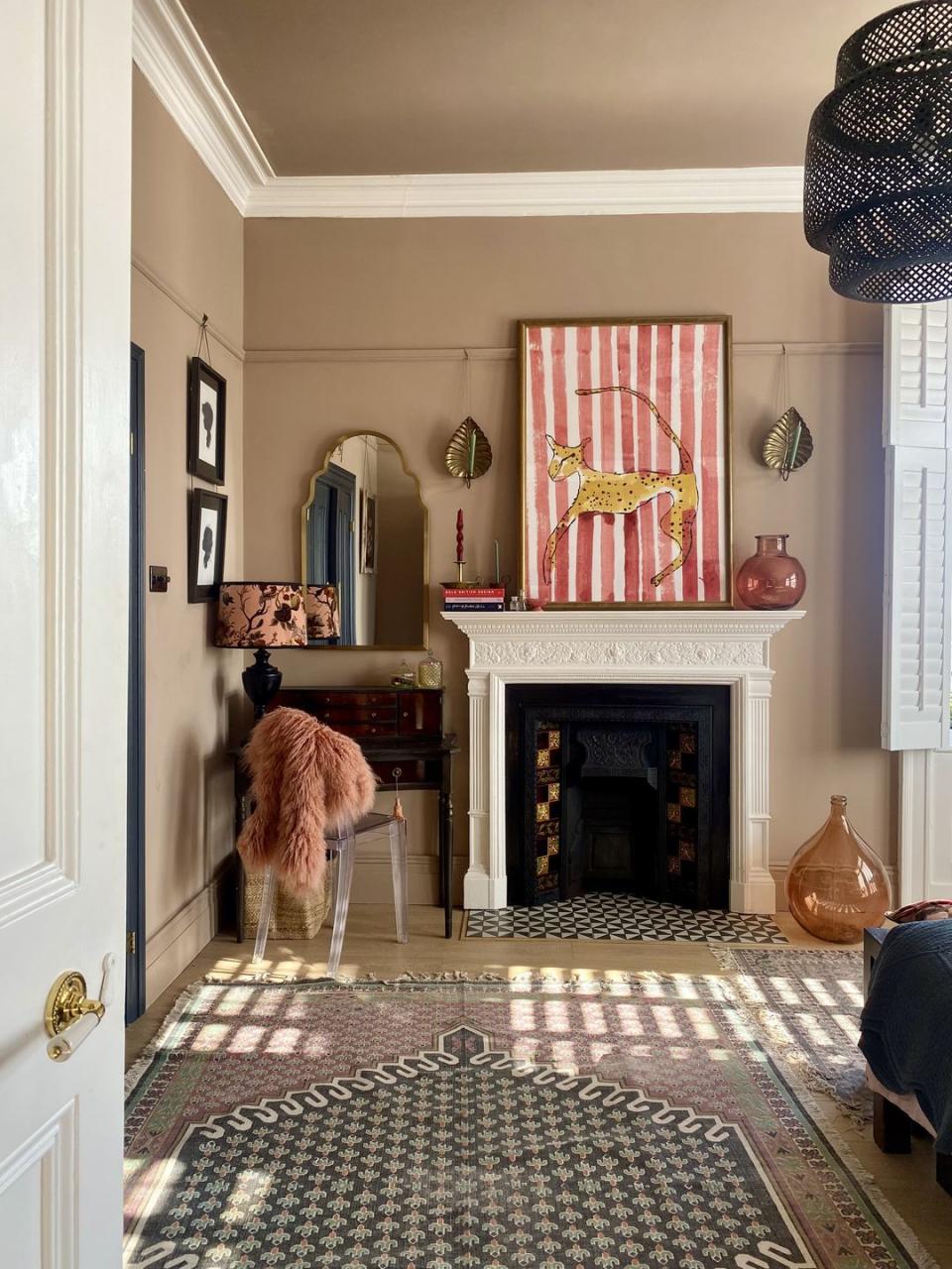 bedroom with original fireplace and dressing table