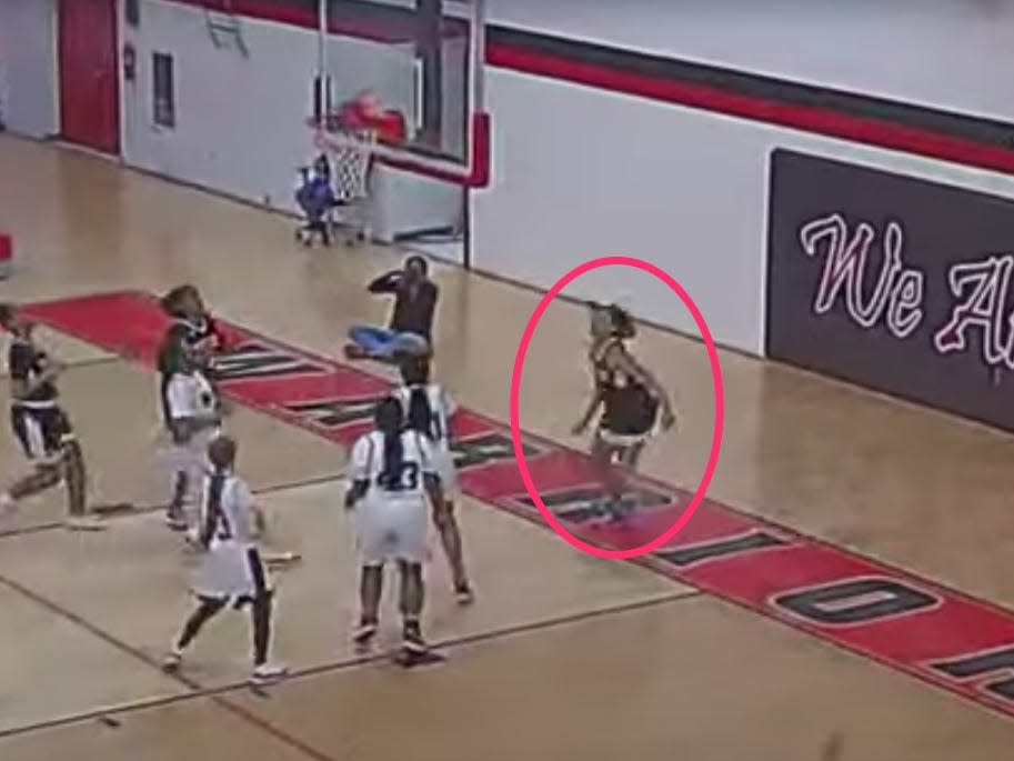 A screenshot of a video showing what appears to be Arlisha Boykins, circled, playing a junior varsity basketball game.