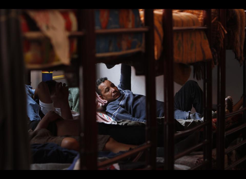 In this May 12, 2012 photo, Central American migrants rest at a migrant shelter while waiting for a northern bound train in Lecheria, on the outskirts of Mexico City. While the number of Mexicans heading to the U.S. has dropped dramatically, a surge of Central American migrants is making the 1,000-mile northbound journey this year, fueled in large part by the rising violence brought by the spread of Mexican drug cartels. (AP Photo/Marco Ugarte)