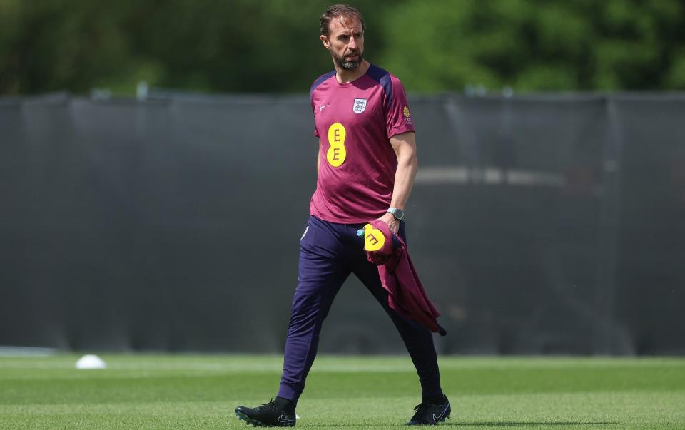 England manager Gareth Southgate walking on the training field