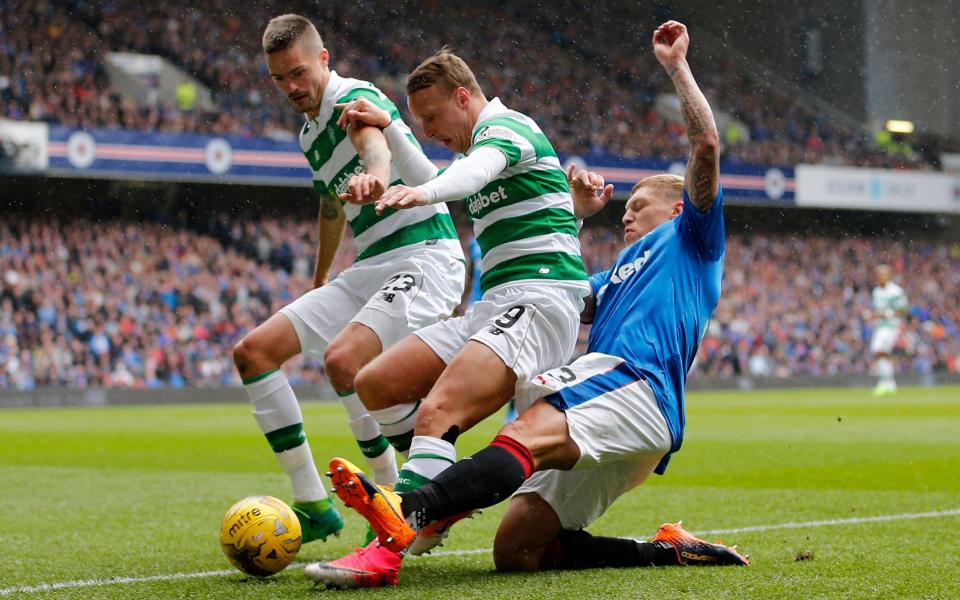 Celtic's Mikael Lustig and Leigh Griffiths in action - Credit: REUTERS