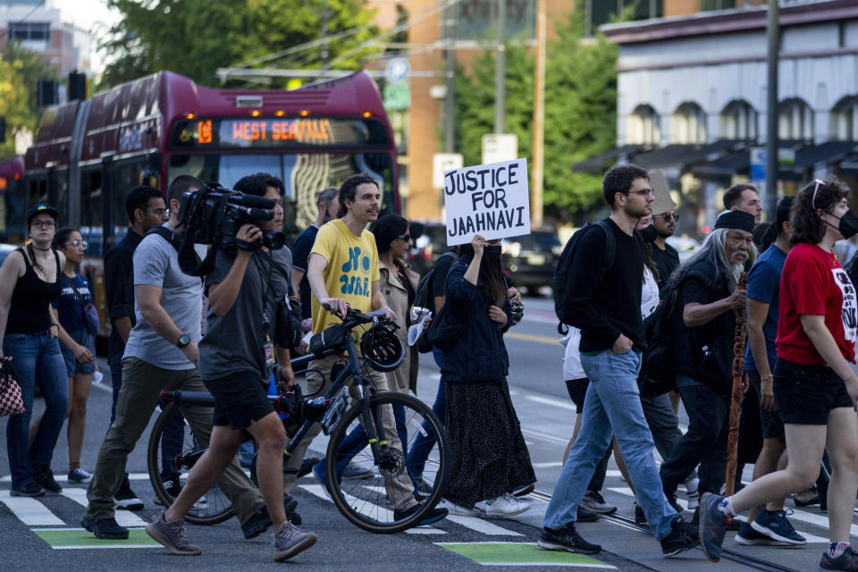 FILE - Protesters march through downtown Seattle after body camera footage was released of a Seattle police officer joking about the death of Jaahnavi Kandula, a 23-year-old woman hit and killed in January by officer Kevin Dave in a police cruiser, Thursday, Sept. 14, 2023, in Seattle. Prosecutors in Washington state said Wednesday, Feb. 21, 2024, they will not file felony charges against the Seattle police officer who struck and killed the graduate student from India while responding to an overdose call. (AP Photo/Lindsey Wasson, File)