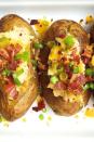 <p>We're still drooling over these stuffed spuds.</p><p>Get the <a href="https://www.delish.com/uk/cooking/recipes/a29531370/loaded-baked-potatoes-bacon-cheddar-recipe/" rel="nofollow noopener" target="_blank" data-ylk="slk:Loaded Baked Potatoes;elm:context_link;itc:0;sec:content-canvas" class="link ">Loaded Baked Potatoes</a> recipe.</p>