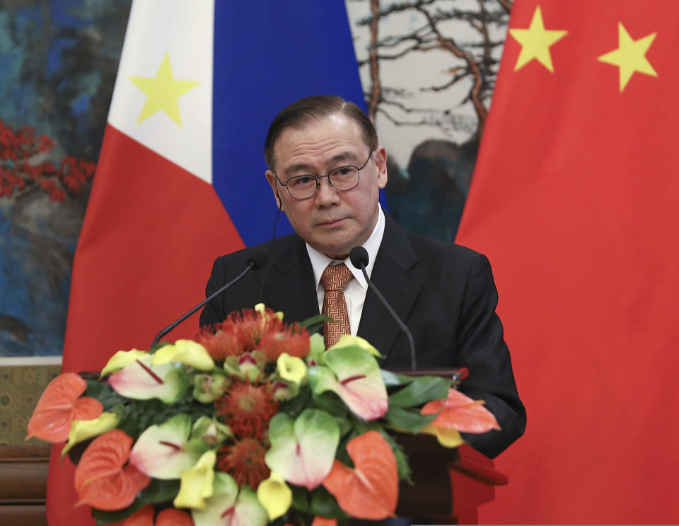 FILE - In this March 20, 2019, file photo, Philippines Secretary of Foreign Affairs Teodoro Locsin listens to a question by the press during the press conference at the end of the meeting with Chinese Foreign Minister Wang Yi at the Diaoyutai State Guesthouse in Beijing. Locsin heaped praise on China's ruling Communist Party during a visit to Beijing, underscoring the growing distance between the Philippines and the United States as China's regional political and economic influence rises. (Andrea Verdelli/Pool Photo via AP, File)