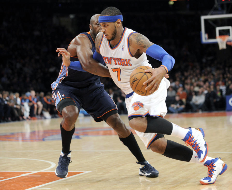 New York Knicks' Carmelo Anthony, right, drives by Charlotte Bobcats' Anthony Tolliver during the second quarter of an NBA basketball game, Friday, Jan. 24, 2014, at Madison Square Garden in New York. (AP Photo/Bill Kostroun)