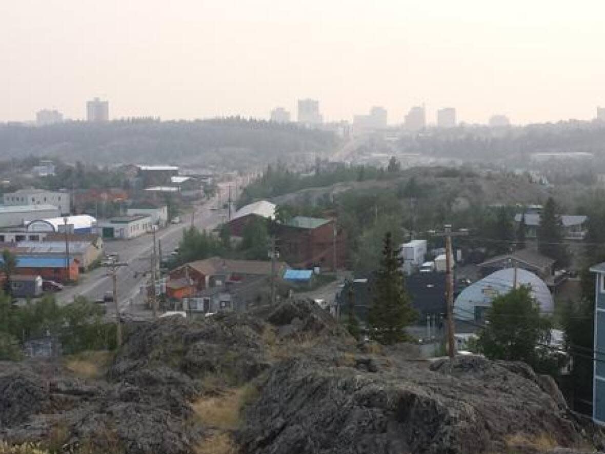 Smoke hovers over the City of Yellowknife on July 10, 2014. Also known as 'the summer of smoke,' 2014 is etched in N.W.T. residents' minds as the worst wildfire season on record. (Sara Minogue/CBC - image credit)