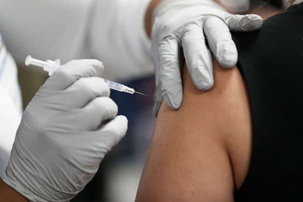 PHOTO: A healthcare worker at the Jackson Health Systems receives a Pfizer-BioNtech Covid-19 vaccine at the Jackson Memorial Hospital, Dec. 15, 2020, in Miami. (Joe Raedle/Getty Images)