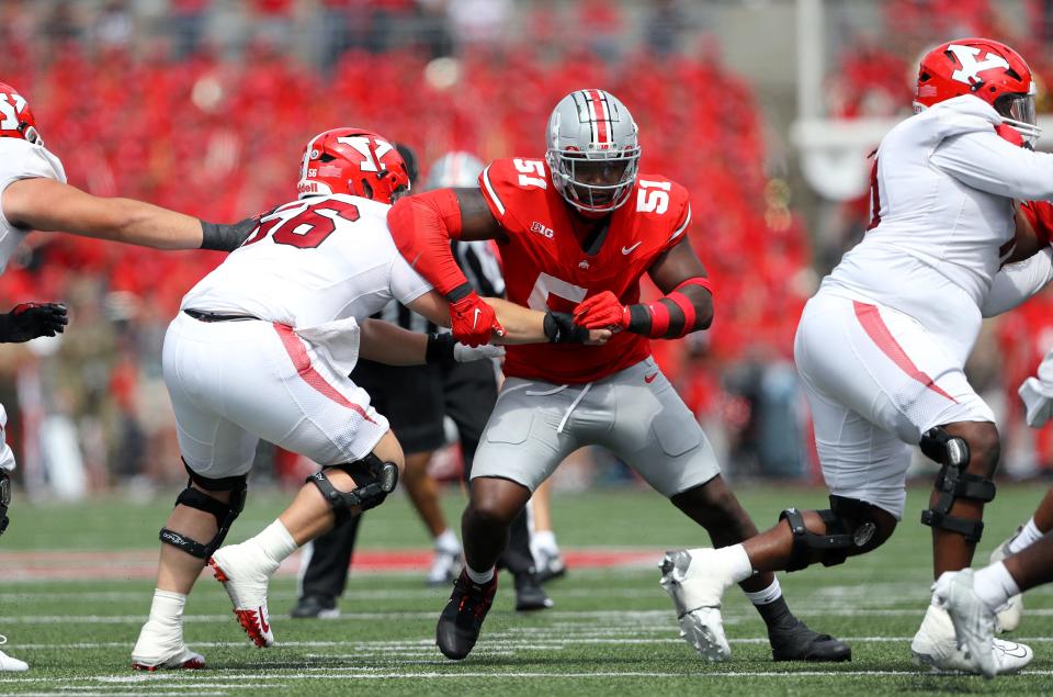 Ohio State defensive tackle Michael Hall Jr. (51) gets past the block of Youngstown State offensive lineman Aidan Parker (56) on Sept. 9, 2023, in Columbus.