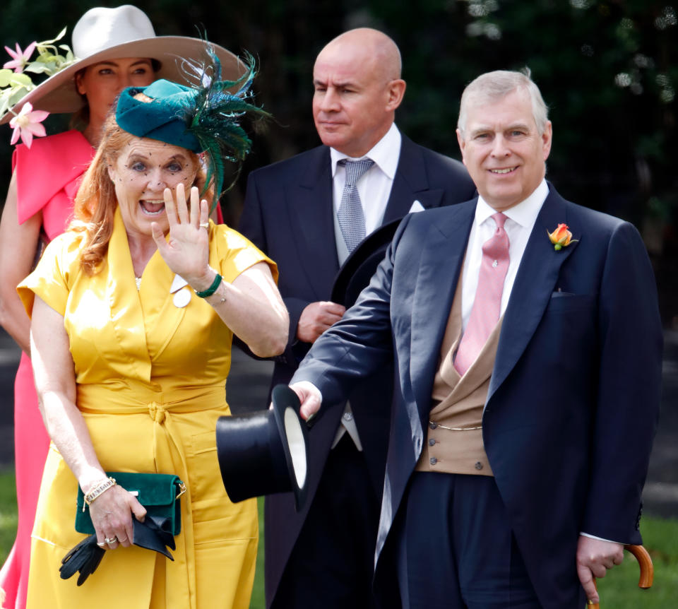 Sarah Ferguson waves in yellow dress with Prince Andrew at Ascot