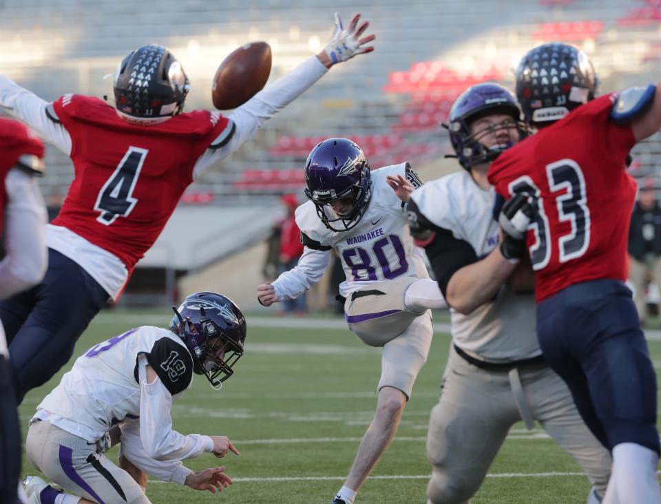 Brookfield East's Hayden Doyle (4) blocks the potential game-tying extra point of Waunakee kicker Adrian Driscoll with 8 seconds remaining in the Division 2 state title game on Nov. 22, 2019.