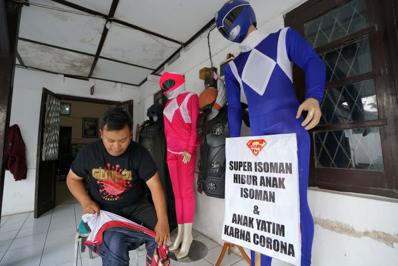 Man donning superhero costumes brings cheer to children confined to their homes by COVID-19 restrictions in Sukoharjo