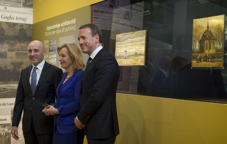 FILE - In Tuesday, March 21, 2017 file photo General Gianluigi D'Alfonso of the Italian Guardia Di Finanza, left, Jet Bussemaker, Minister for Education, Culture and Science, center, and Van Gogh Museum director Axel Rueger pose in front of two stolen and recovered van Gogh paintings, titled "Seascape at Scheveningen" (1882) and "Congregation leaving the Reformed Church in Nuenen," (1884-1885) during a press conference in Amsterdam, Netherlands. The alleged top drug trafficker suspected of having bought two stolen Van Gogh paintings on the black market and one of Italy's most wanted men, Raffaele Imperiale, has been arrested in Dubai, Naples-based police said Thursday, Aug. 19, 2021. (AP Photo/Peter Dejong)