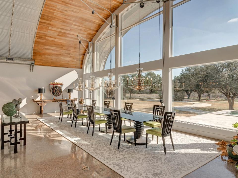 The dining area is located by a large glass window.