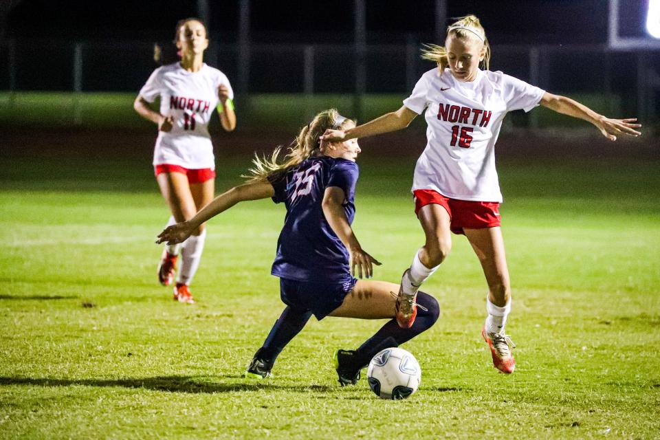 North Fort Myers Alexis Neumann and Estero's Alena Smyrnios went around in circles fighting for the ball. Action as North Fort Myers beat Estero 3-1 in their Tuesday night matchup. 