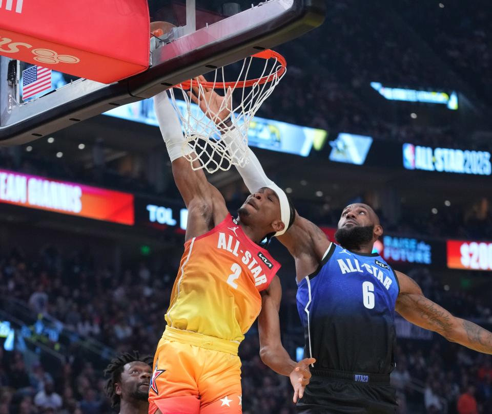 Team Giannis guard Shai Gilgeous-Alexander (2) attempts a shot against Team LeBron forward LeBron James (6) in the NBA All-Star Game at Vivint Arena on Sunday night in Salt Lake City.