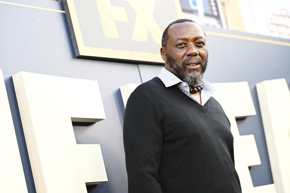 Edwin Lee Gibson in a sweater and collared shirt at the premiere of The Bear