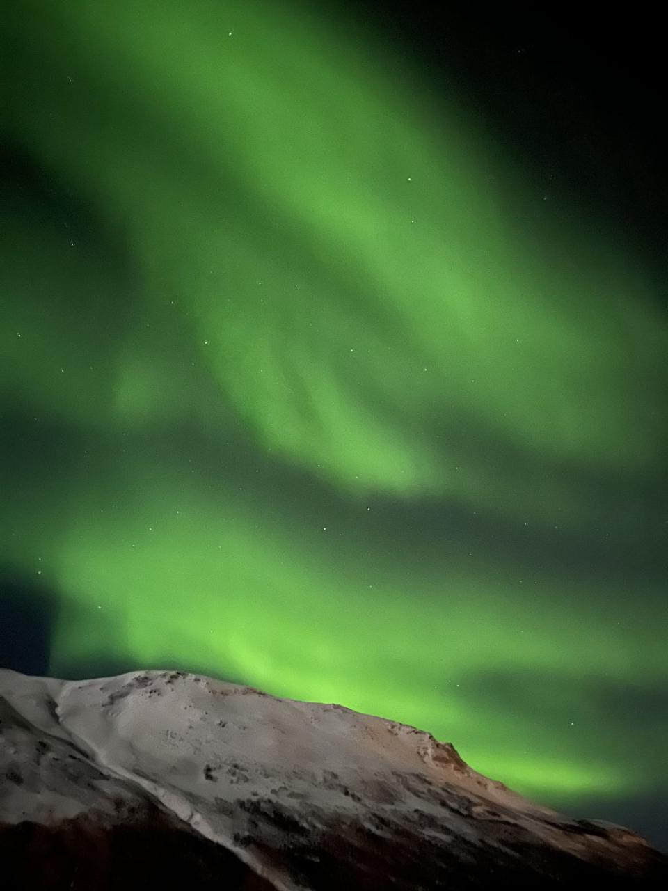 a green aurora in the sky