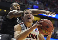 San Diego State guard Xavier Thames, left, defends as Arizona forward Aaron Gordon drives during the first half of an NCAA men's college basketball tournament regional semifinal, Thursday, March 27, 2014, in Anaheim, Calif. (AP Photo/Mark J. Terrill)