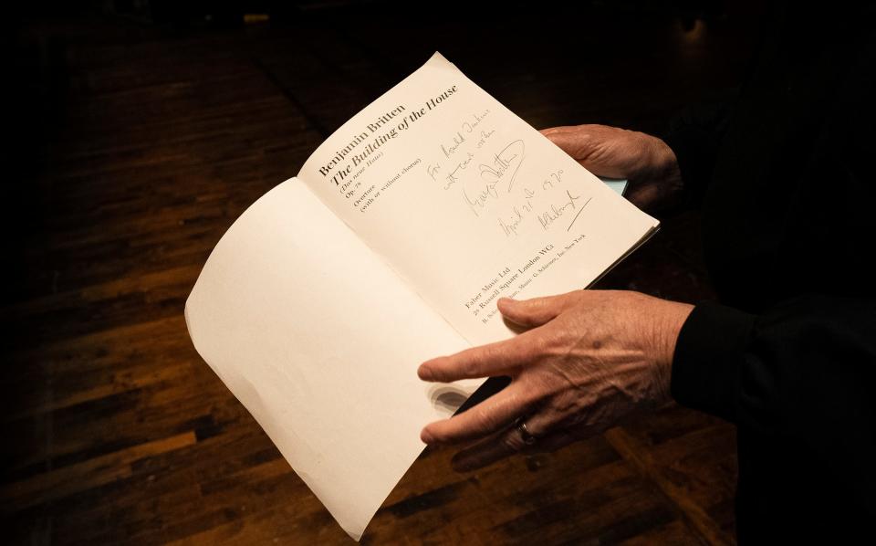 Columbus Symphony Chorus director Ronald Jenkins shows his signed sheet music for Benjamin Britten's "The Building of the House," which will be performed in the second half of his final show before his retirement.