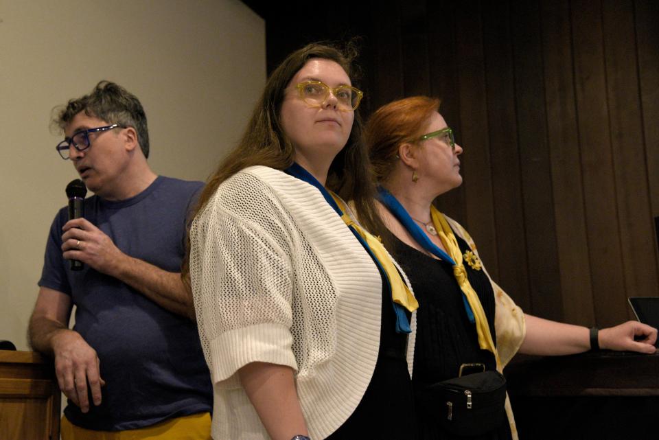 From left: David Halbout, Maiia Dvokina and Nathalie Halbout during a Ukrainian fundraiser for first aid kits on Friday, April 14, 2023 at the Unitarian Universalist meeting house in Middletown, New Jersey. 