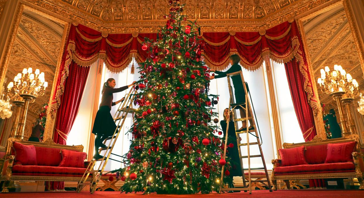 A Christmas tree standing at 15ft is decorated in the Queen's Windsor Castle [Image: PA Images]