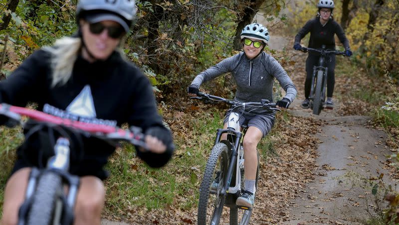 Cassandra Wight, left, Alya Hopkins and Kamryn Anderson ride e-bikes down the Rush Trail in Draper’s Corner Canyon on Wednesday, Oct. 25, 2023.