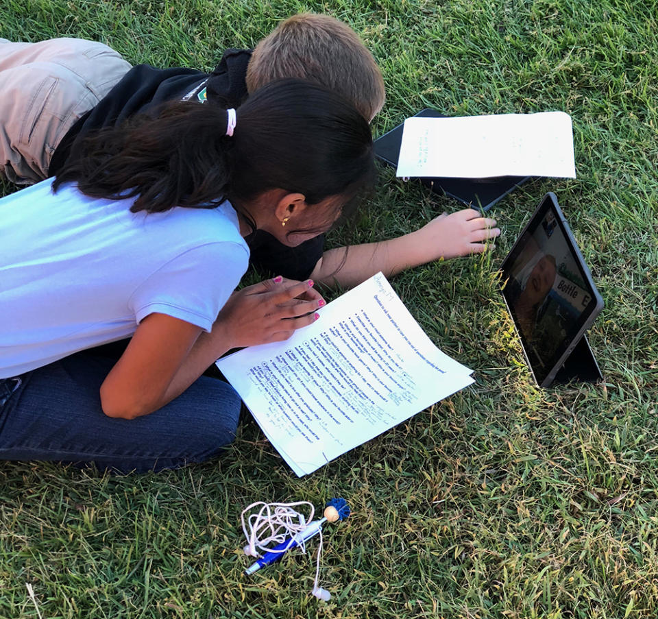 Students learn outside at Gowan Science Academy. Next year, they will have an outdoor classroom on campus. (Alissa Guevara)